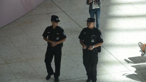 Chinese police patrol part of the West Kowloon Station in Hong Kong which is under Chinese law.  