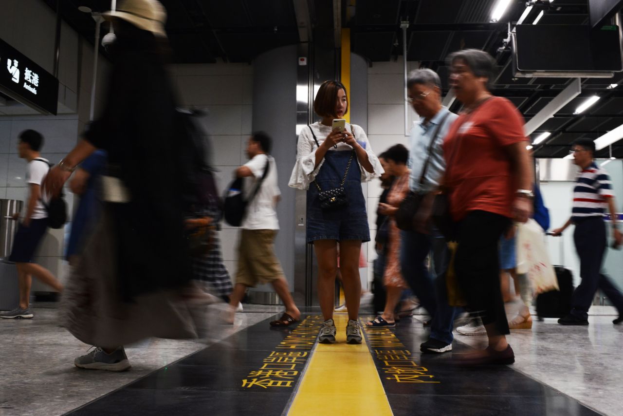 Passengers seen inside West Kowloon Station, bound for mainland China on the first ever high-speed trains to depart Hong Kong. 