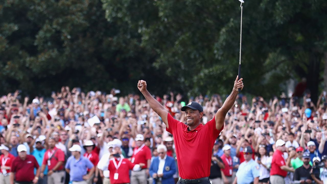 ATLANTA, GA - SEPTEMBER 23: Tiger Woods of the United States celebrates making a par on the 18th green to win the TOUR Championship at East Lake Golf Club on September 23, 2018 in Atlanta, Georgia. (Photo by Tim Bradbury/Getty Images)
