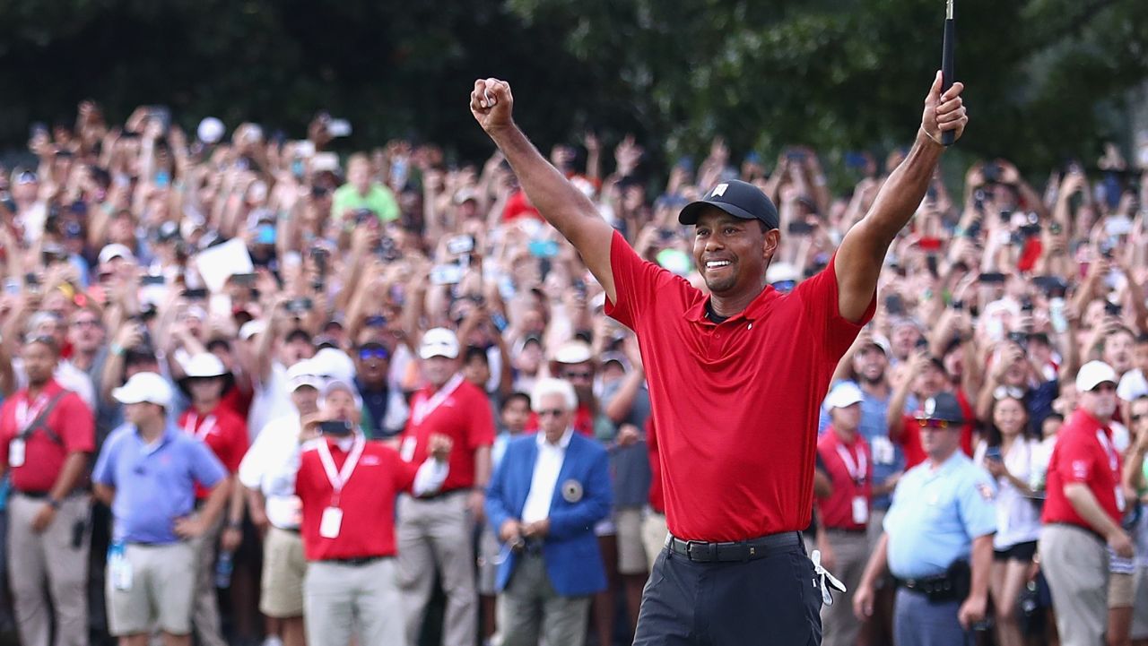 ATLANTA, GA - SEPTEMBER 23:  Tiger Woods of the United States celebrates making a par on the 18th green to win the TOUR Championship at East Lake Golf Club on September 23, 2018 in Atlanta, Georgia.  (Photo by Tim Bradbury/Getty Images)