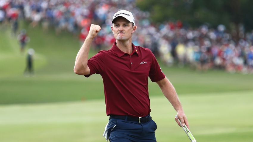 ATLANTA, GA - SEPTEMBER 23:  Justin Rose of England celebrates on the 18th green prior to winning the 2018 FedEx Cup during the final round of the TOUR Championship at East Lake Golf Club on September 23, 2018 in Atlanta, Georgia.  (Photo by Tim Bradbury/Getty Images)