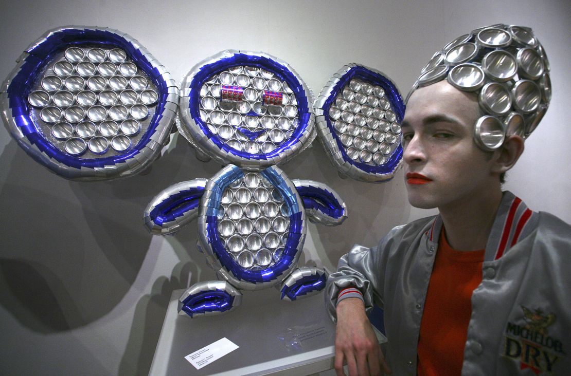 A model poses near a sculpture of Cheburashka during an exhibition in Moscow in 2008.