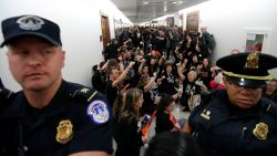 Capitol Hill Police move the crowd back as protesters speak out against Judge Brett Kavanaugh outside the office of Sen. Susan Collins, R-Maine, on Capitol Hill, Monday, Sept. 24, 2018 in Washington. A second allegation of sexual misconduct has emerged against Judge Brett Kavanaugh, a development that has further imperiled his nomination to the Supreme Court, forced the White House and Senate Republicans onto the defensive and fueled calls from Democrats to postpone further action on his confirmation. President Donald Trump is so far standing by his nominee. (AP Photo/Alex Brandon)