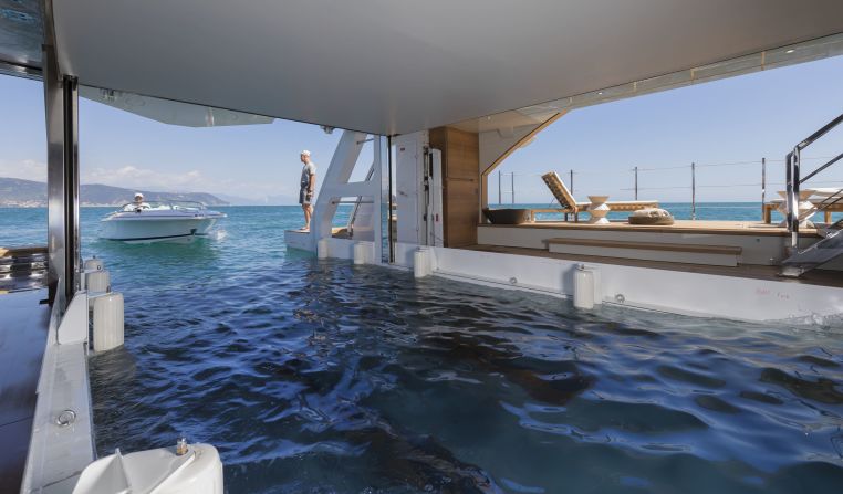 Seven Sin features a float-in tender garage which also transforms into a beach club -- which has fold-down side balconies and is fully equipped with a gym and sauna.