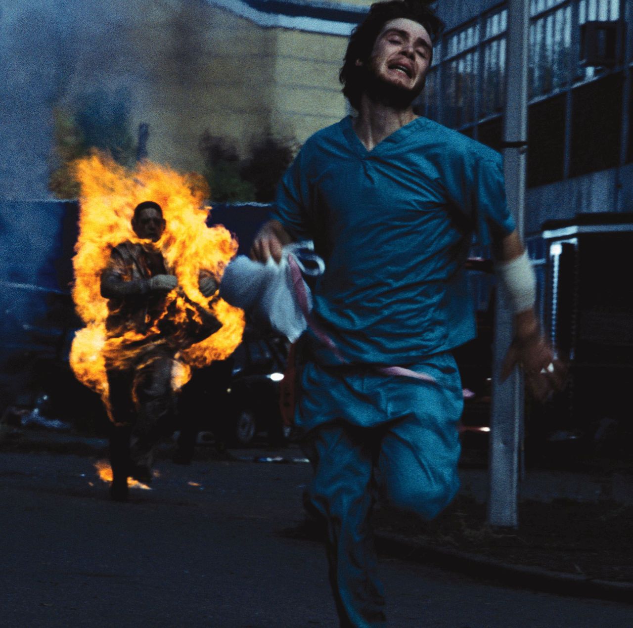Cillian Murphy fleeing fast zombies in "28 Days Later" (2002).