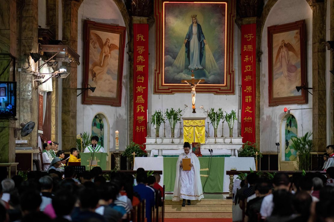 Christian devotees attend a mass at the South Cathedral in Beijing on September 22.