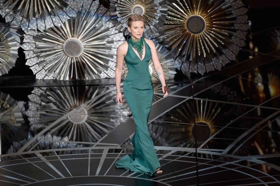Scarlett Johansson walks onstage during the 2015 Academy Awards.