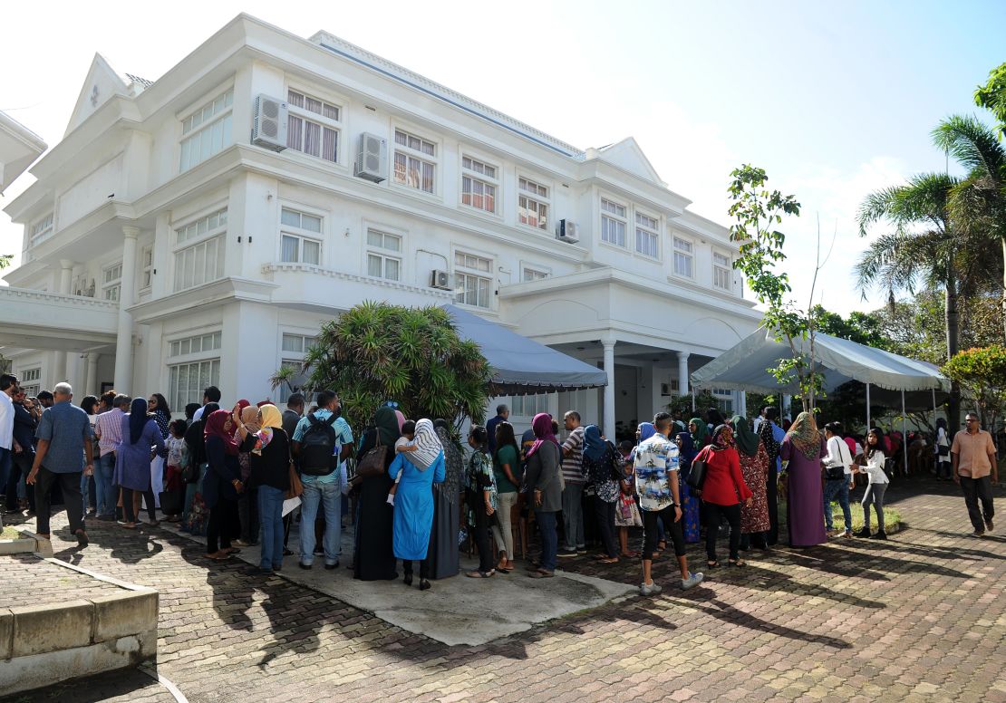 Maldivian voters living in Sri Lanka line up to cast their votes at the Maldivian High Commission in Colombo on September 23, 2018.