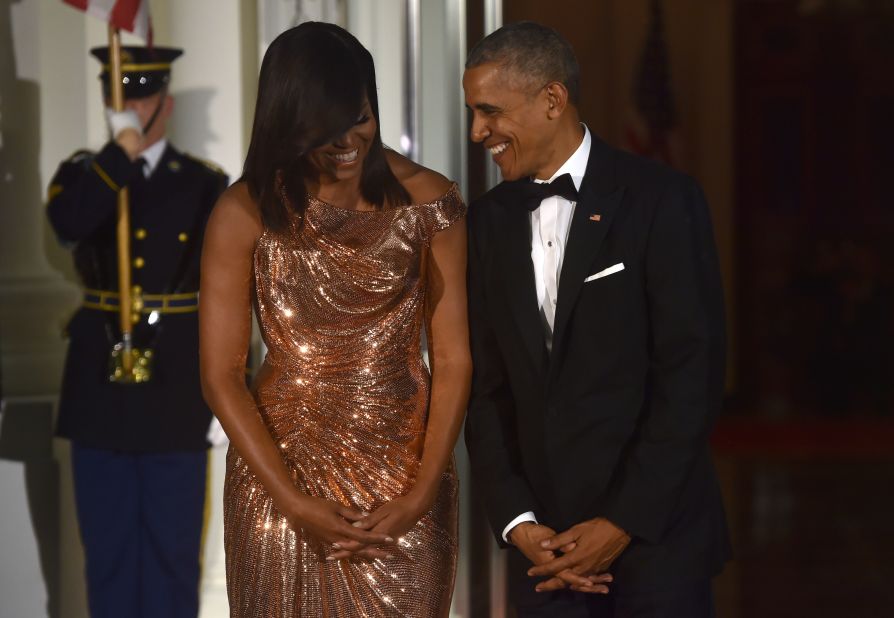Michelle Obama, next to Barack Obama, wears glittering Versace ahead of a state dinner with Italian Prime Minister Matteo Renzi and his wife Agnese Landini in 2016.