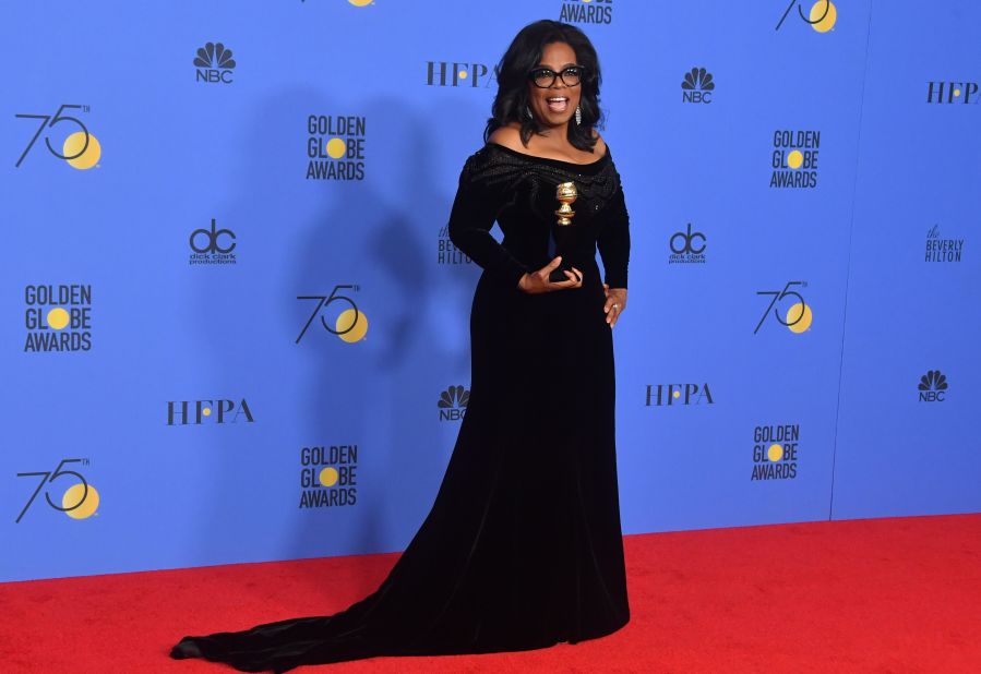 Oprah Winfrey poses with her Cecil B. DeMille Award during the 2018 Golden Globes.