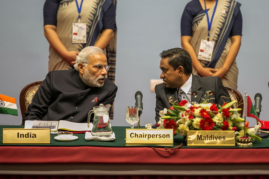 Indian PM Narendra Modi speaks to Maldives President Abdulla Yameen during the inaugural session of the 18th SAARC Summit on November 26, 2014.