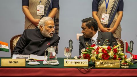 Indian PM Narendra Modi speaks to Maldives President Abdulla Yameen during the inaugural session of the 18th SAARC Summit on November 26, 2014.