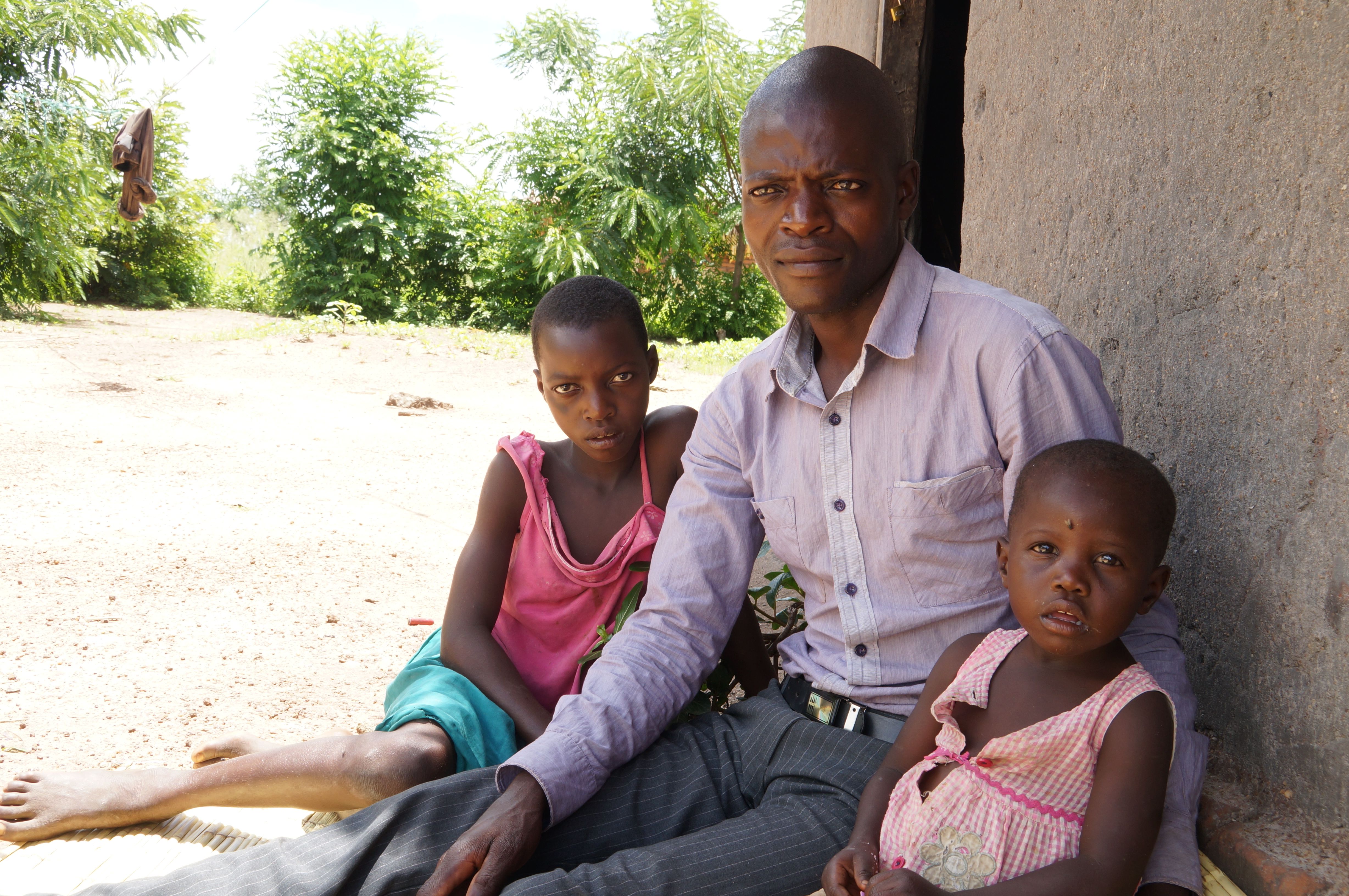 Minyatso with his children at their home in Kaseleka.
