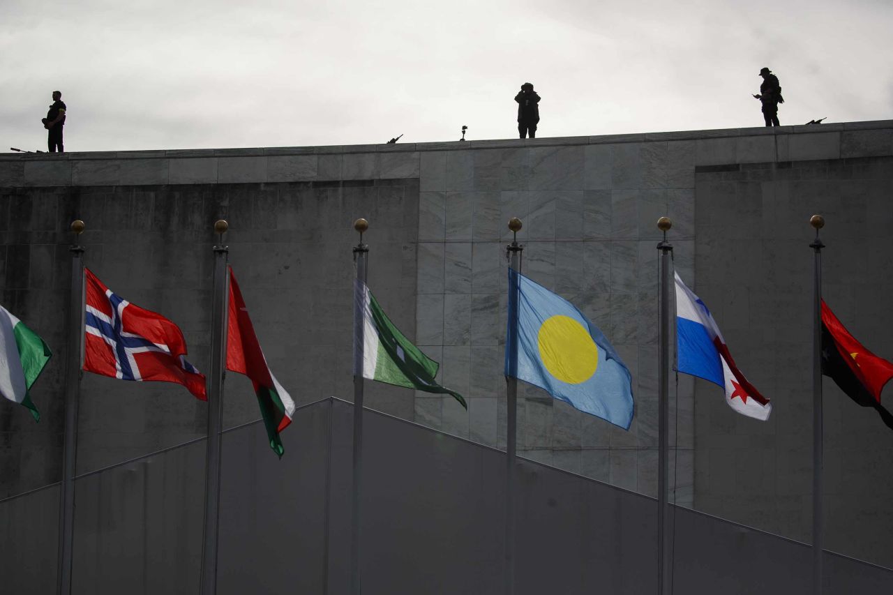 Counter-snipers stand on the roof of the UN building on Monday.