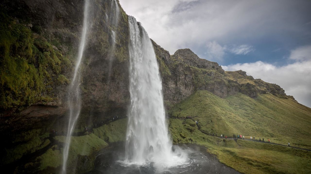 <strong>Seljalandsfoss, Iceland:</strong> Iceland's Seljalandsfoss waterfall features a 60-meter drop (197 feet) and is part of the Seljalands River. Visitors here are able to walk behind the falls and explore the cave behind. 