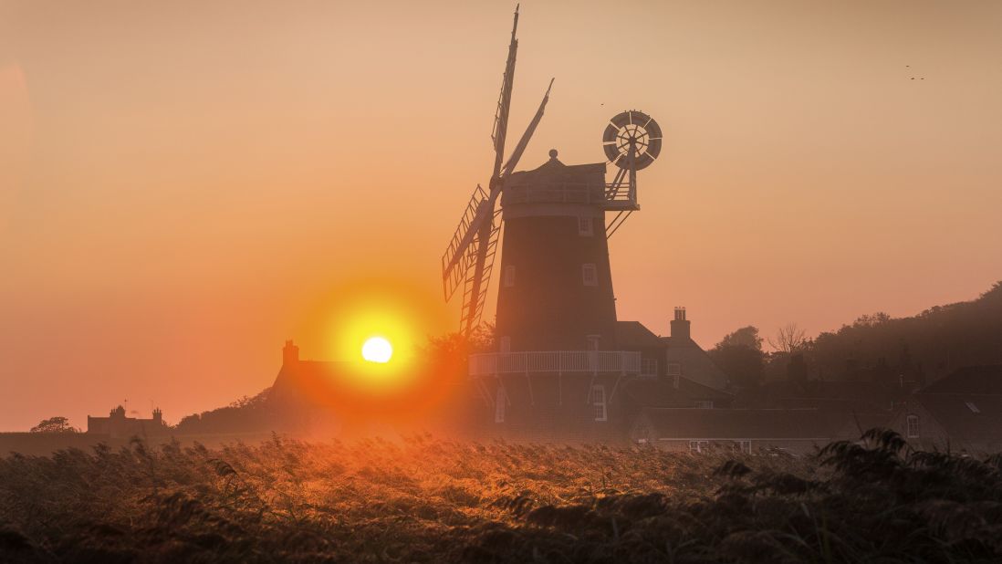 <strong>Cley next the Sea, England: </strong>The 18th-century Cley Windmill is lit dramatically at sunrise on the Norfolk coast in England's East Anglia. 
