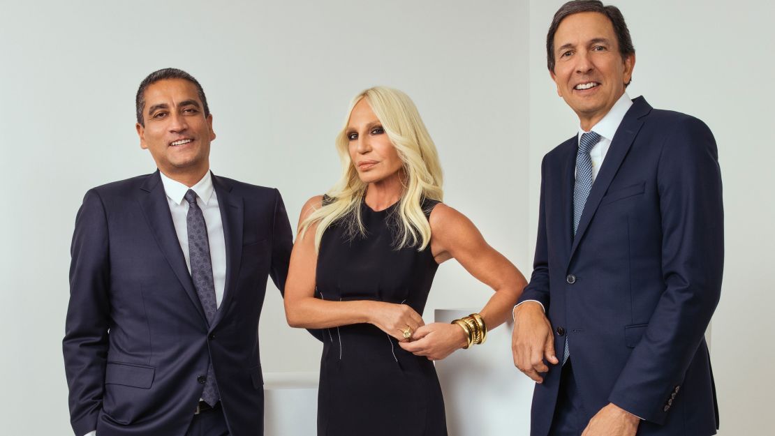 Versace executive Jonathan Akeroyd, designer Donatella Versace and Michael Kors CEO John Idol.