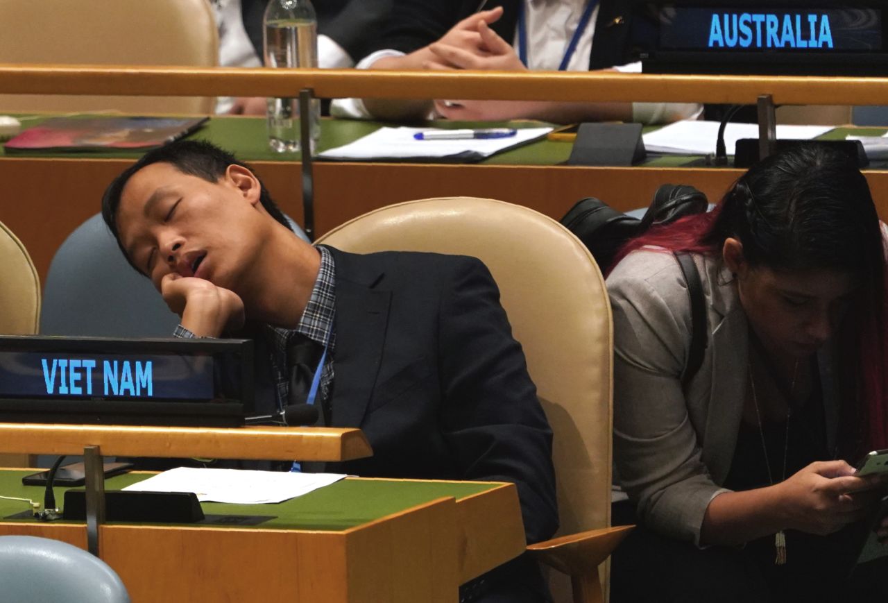 A member of the Vietnamese delegation naps during Tuesday's proceedings.