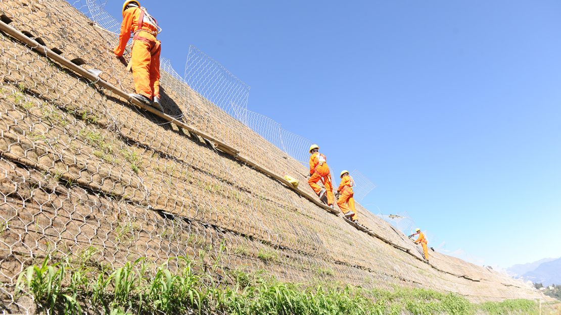 Runway developer Punj Lloyd had to build an 80-meter-high reinforcement wall to accomodate the new airport. 