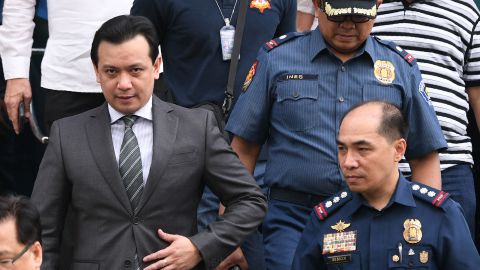 Philippines senator Antonio Trillanes (L) leaves a police station after being arrested in Manila on September 25, 2018. 