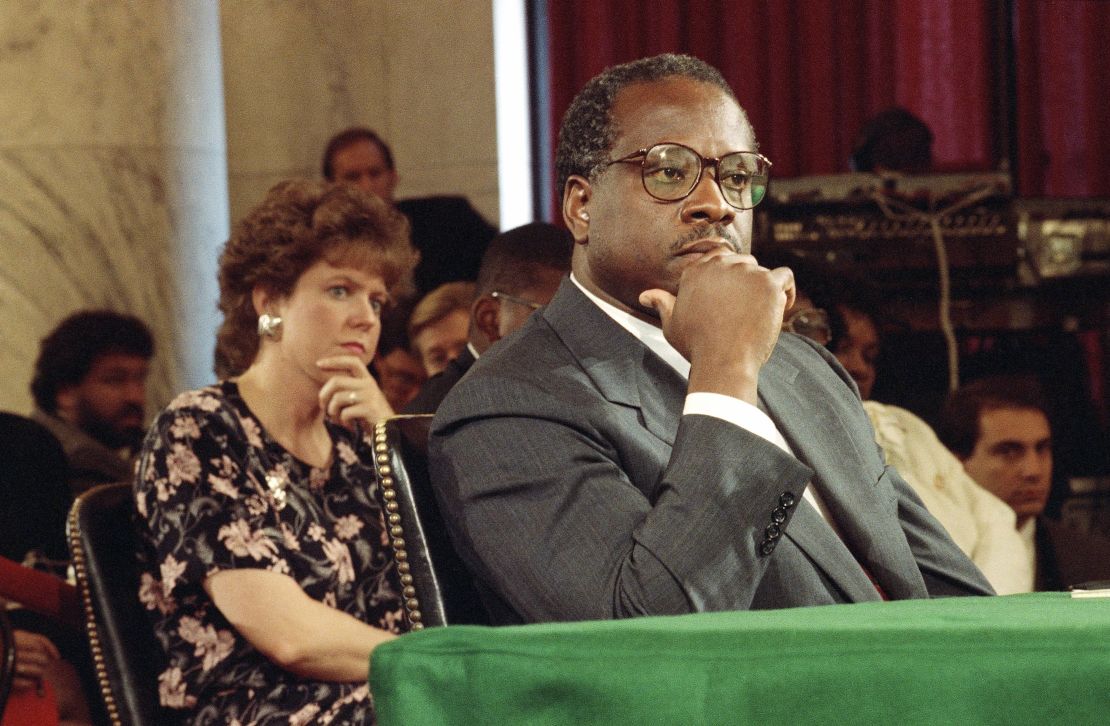 Then-Supreme Court Justice nominee Clarence Thomas and his wife Virginia listen during his nomination hearing before the Senate Judiciary Committee in 1991.
