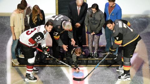 The ceremonial first puck is dropped between Oliver Ekman-Larsson of the Arizona Coyotes and Jason Garrison of the Golden Knights before the Golden Knights' inaugural regular-season home opener against the Coyotes at T-Mobile Arena on October 10, 2017.