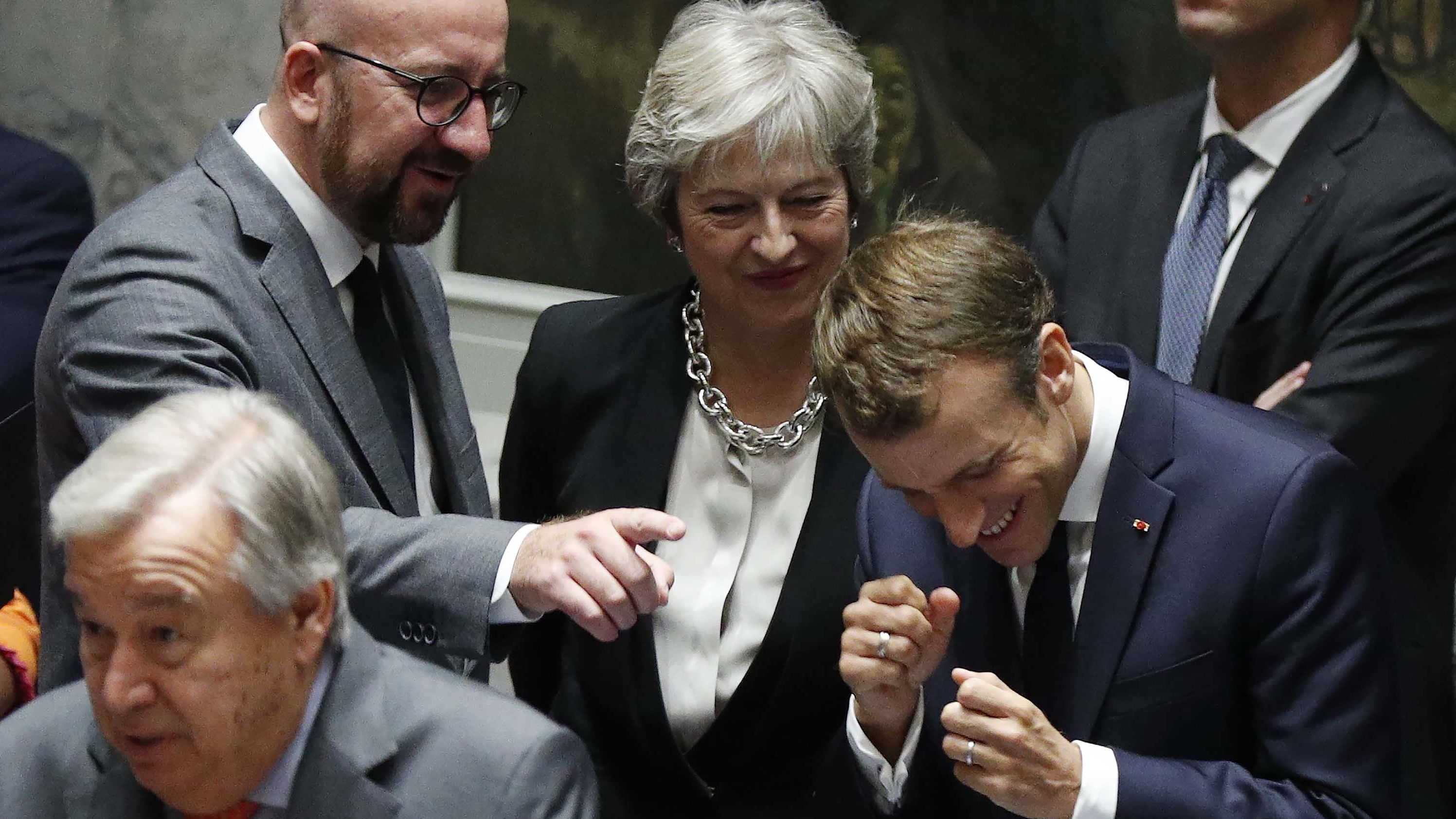 From left, Belgian Prime Minister Charles Michel, British Prime Minister Theresa May and French President Emmanuel Macron share a laugh before Wednesday's Security Council meeting.