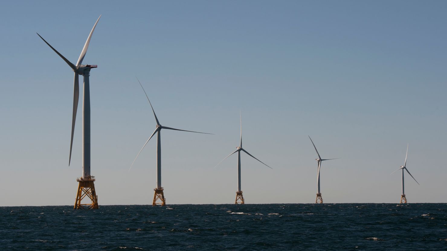 Wind turbines, of the Block Island Wind Farm, tower over the water on October 14, 2016 off the shores of Block Island, Rhode Island.
The first offshore wind project in America generated enough electricity for the entire island. (DON EMMERT/AFP/Getty Images)