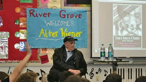 Alter Wiener addresses a group of students at River Grover Elementary School in Lake Oswego, Oregon.