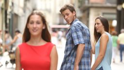 The stock photo of a "distracted boyfriend," which has spurred internet memes.