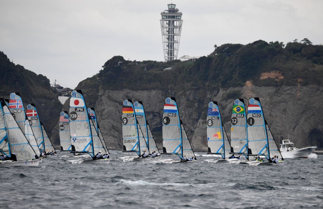 Athletes compete during the sailing World Cup series, a test event of the Tokyo 2020 Olympic Games, in the waters off Enoshima island on September 12, 2018.