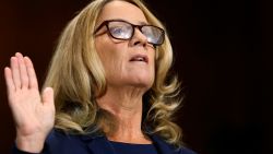 Christine Blasey Ford is sworn in before the Senate Judiciary Committee, Thursday, Sept. 27, 2018 on Capitol Hill in Washington.  The Senate Judiciary Committee will hear from Supreme Court nominee Brett Kavanaugh and Christine Blasey Ford, the woman who says he sexually assaulted her. (Michael Reynolds/Pool Image via AP)