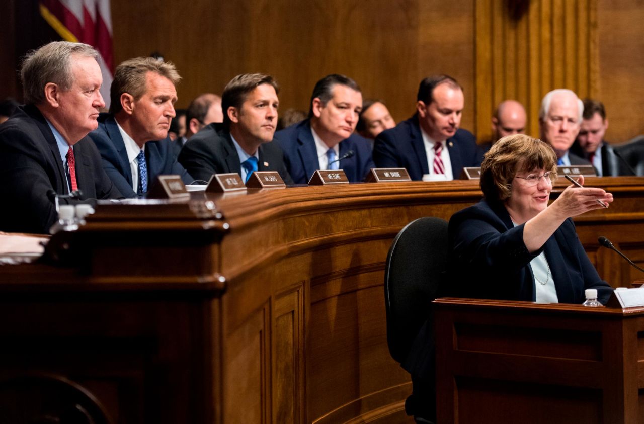 The Senate Republicans on the committee, all of whom are male, attend Thursday's hearing. At the bottom right is Rachel Mitchell, a prosecutor from Arizona who questioned Ford on their behalf.