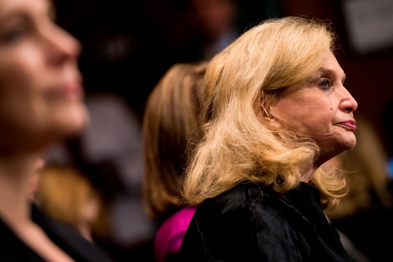 A tear runs down the cheek of US Rep. Carolyn Maloney during Ford's testimony.