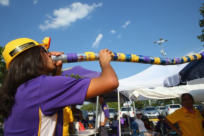 An LSU Tigers fan drinks a beer through a funnel before a game against the TCU Horned Frogs at AT&T Stadium on August 31, 2013 in Arlington, Texas. 