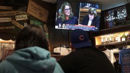 Patrons watch the television at the Billy Goat Tavern during the Senate Judiciary Committee on Capitol Hill where professor Christine Blasey Ford was testifying about being sexually assaulted by Supreme Court nominee Brett Kavanaugh on September 27, 2018 in Chicago, Illinois.