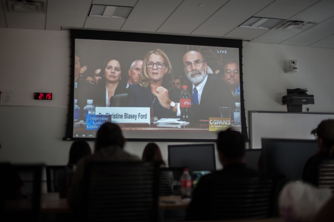 Students watch in a conference room at Fordham Law School in New York.