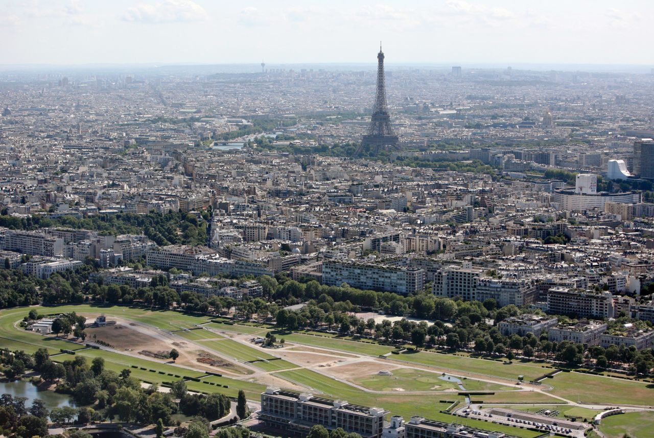 An aerial photograph of Longchamp showing Paris and the Eiffel Tower in the distance. The racecourse has undergone a $145M revamp.