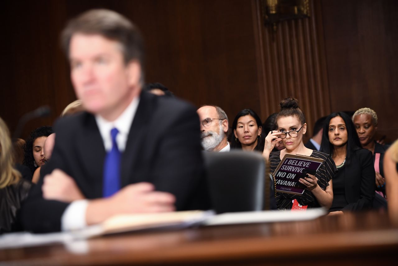 Actress Alyssa Milano, <a href="https://www.cnn.com/politics/live-news/kavanaugh-ford-sexual-assault-hearing/h_39b1770d70446d51fb90299dcdf73ac4" target="_blank">who has helped popularize the #MeToo movement,</a> watches Kavanaugh's testimony. Earlier this week, she added her voice to a related hashtag movement, #WhyIDidntReport, to explain why she didn't report her sexual assault to police about 30 years ago.