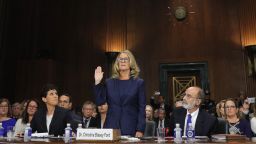 WASHINGTON, DC - SEPTEMBER 27: Professor Christine Blasey Ford, who accused U.S. Supreme Court nominee Brett Kavanaugh of a sexual assault in 1982, is sworn in to testify before a Senate Judiciary Committee confirmation hearing for Kavanaugh on Capitol Hill September 27, 2018 in Washington, DC. A professor at Palo Alto University and a research psychologist at the Stanford University School of Medicine, Ford has accused Supreme Court nominee Judge Brett Kavanaugh of sexually assaulting her during a party in 1982 when they were high school students in suburban Maryland. (Photo by Jim Bourg-Pool/Getty Images)