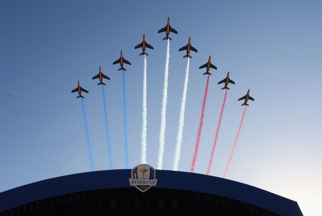 The Patrouille de France flies over during the opening ceremony at Le Golf National.