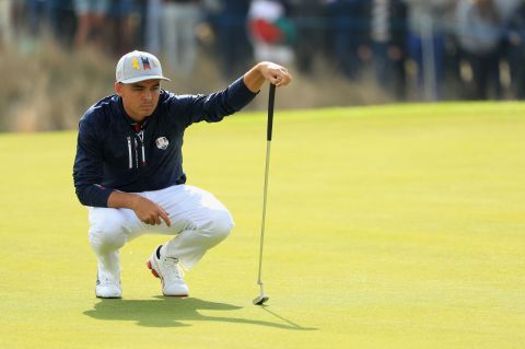 Johnson was paired with Rickie Fowler, and together they won the first point Friday for Team USA.