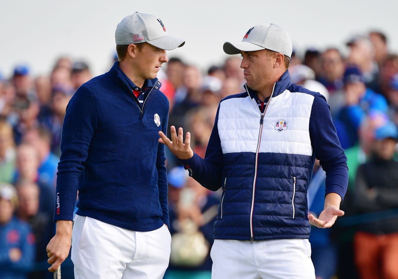Thomas and Spieth of the United States talk during the Friday morning four-ball matches.  