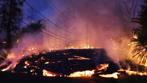 Lava from a Kilauea volcano fissure advances up a residential street in Leilani Estates, Hawaii, on May 27.