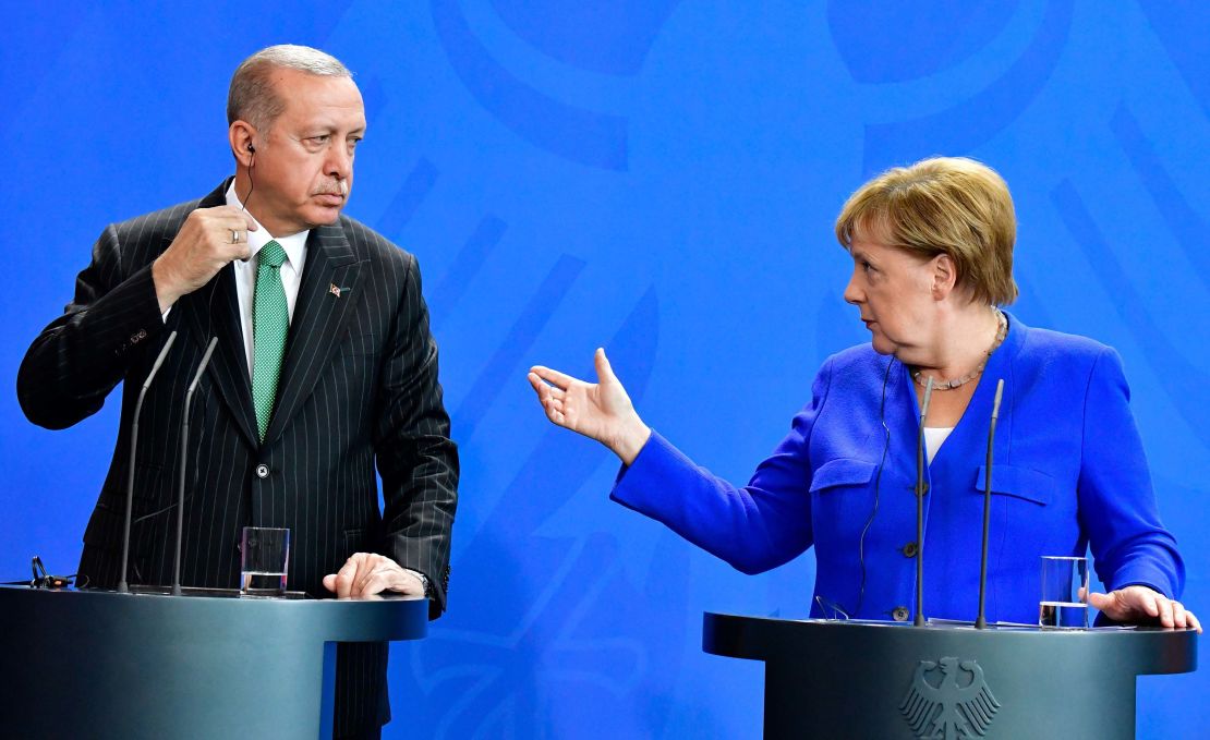 Turkish President Recep Tayyip Erdogan and German Chancellor Angela Merkel hold a joint news conference in Berlin Friday. 