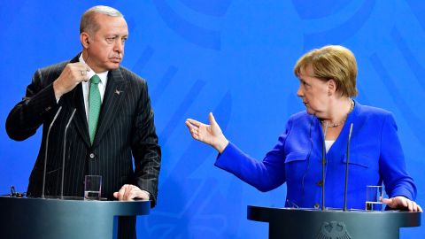 Turkish President Recep Tayyip Erdogan and German Chancellor Angela Merkel hold a joint press conference in Berlin on Friday. 