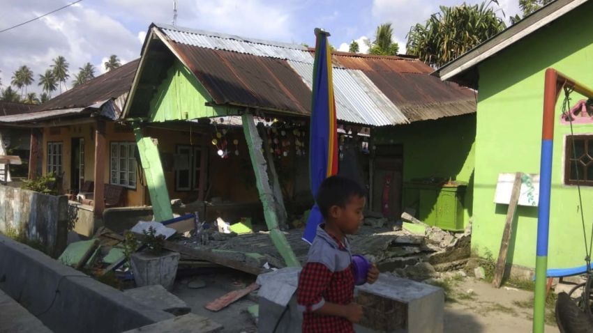 In this photo released by the Disaster Management Agency, a house sits damaged after a magnitude 6.1 earthquake early Friday, Sept. 28, 2018, in Donggala, central Sulawesi, Indonesia. Powerful earthquakes jolted the Indonesian island of Sulawesi on Friday, damaging houses and briefly triggered a tsunami warning. (Disaster Management Agency via AP)