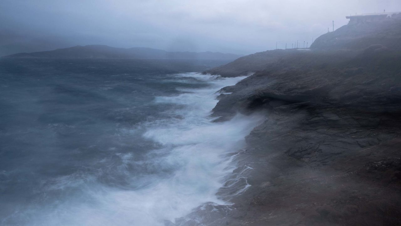 Waves crash on rocks near the port town of Lavrio south of Athens, on Thursday, Sept. 27