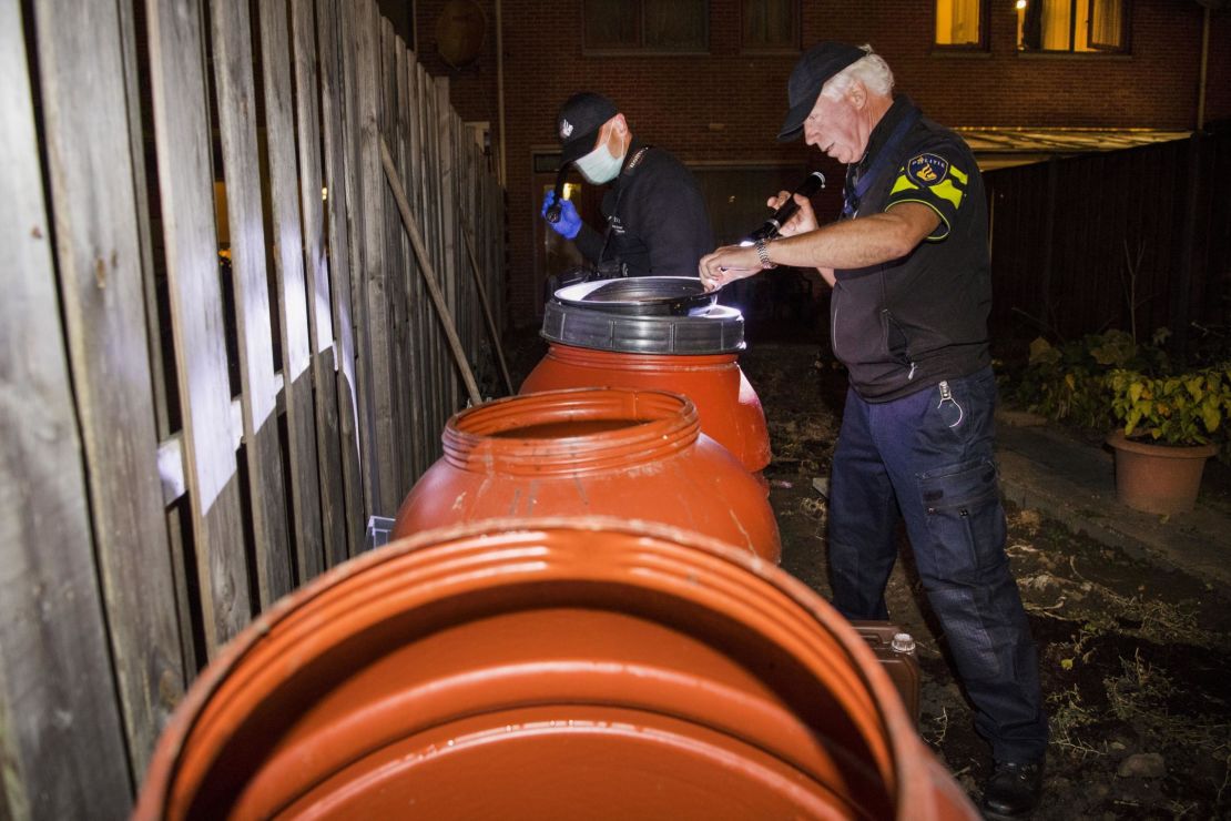 Dutch police officers conduct an investigation at the residence of an alleged jihadist in Arnhem, the Netherlands, on Thursday. 