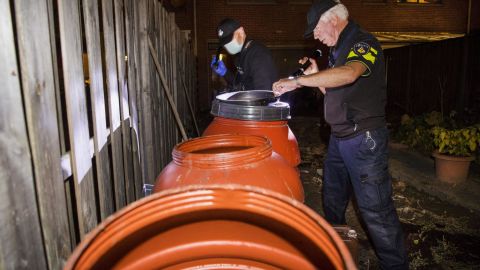 Dutch police officers conduct an investigation at the residence of an alleged jihadist in Arnhem, the Netherlands, on Thursday. 